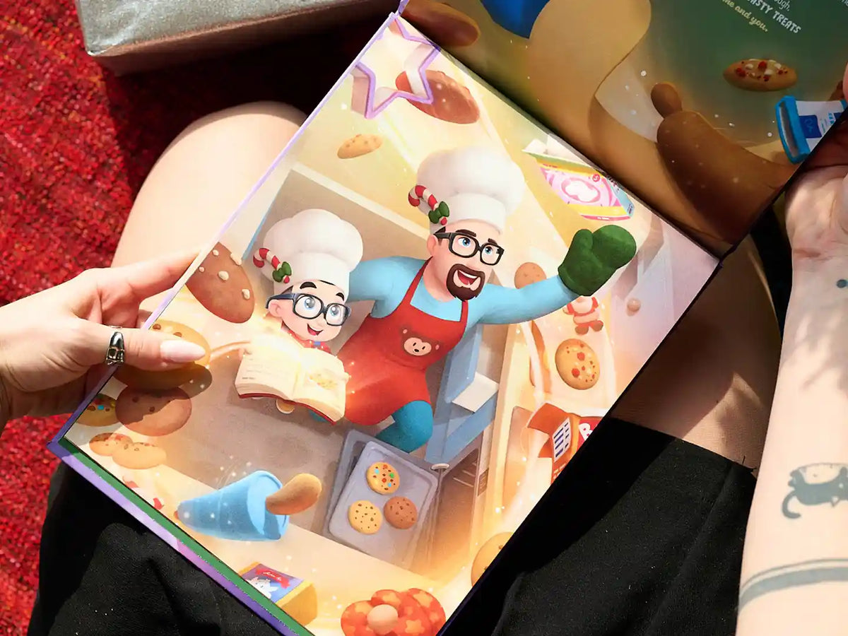 Eine Illustration aus einem personalisierten Weihnachtsbuch, in dem Papa und sein Kleines Kekse backen. 